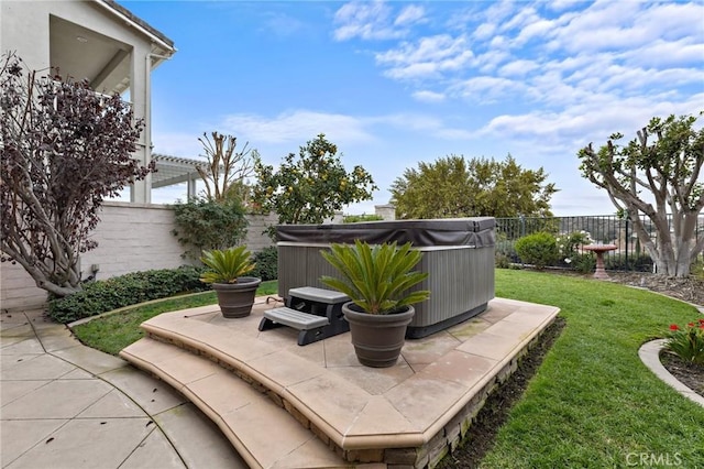 view of patio with a hot tub and a pergola