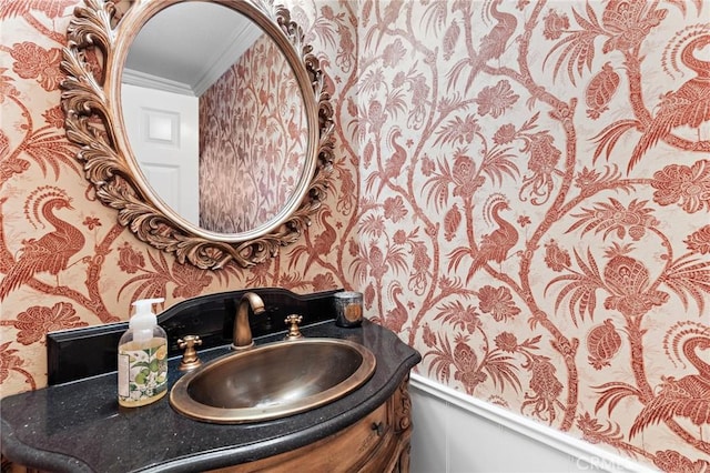 bathroom featuring ornamental molding and vanity