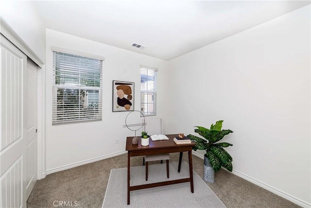 office space with light colored carpet