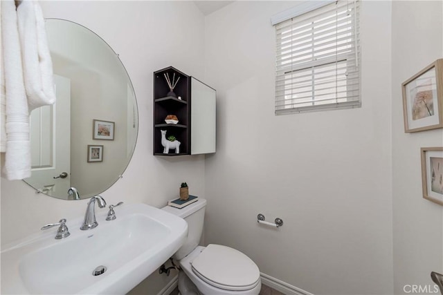 bathroom featuring sink and toilet