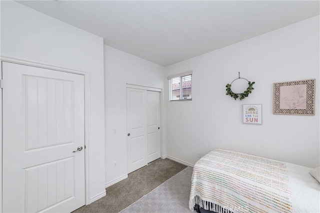 bedroom featuring a closet and carpet flooring