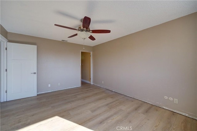 unfurnished bedroom with ceiling fan and light hardwood / wood-style floors