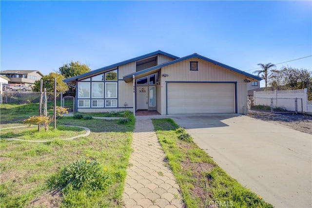 view of front of property with a garage and a front yard