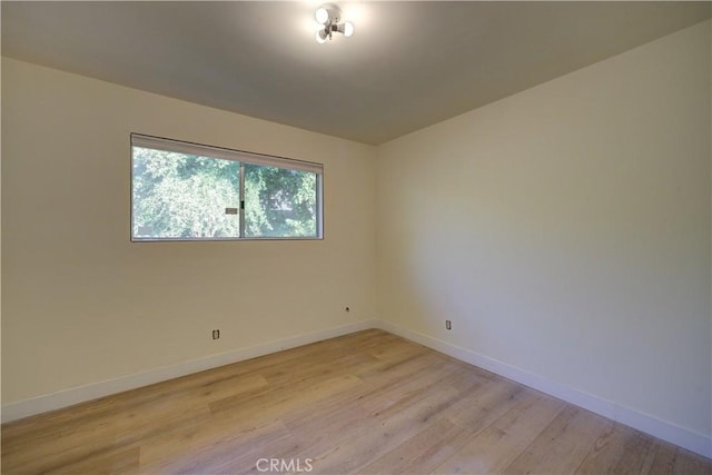 spare room with light hardwood / wood-style flooring