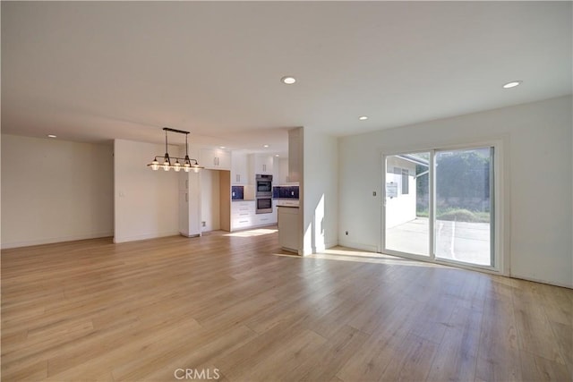 unfurnished living room with light hardwood / wood-style floors