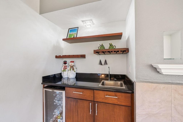 bar with beverage cooler and sink