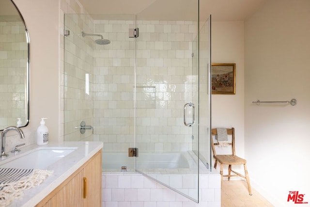 bathroom featuring shower with separate bathtub and vanity