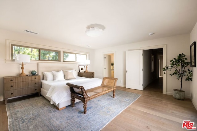 bedroom with light wood-type flooring