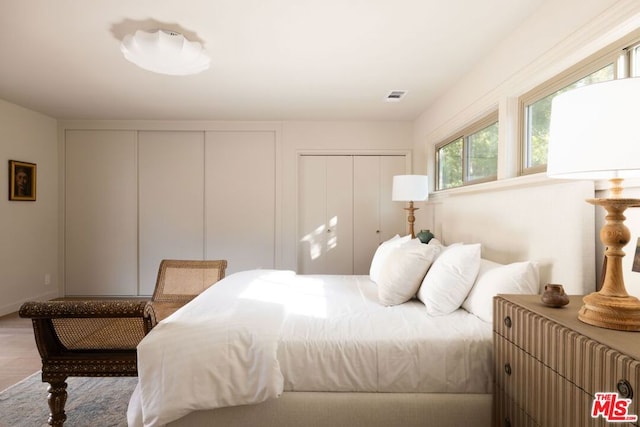 bedroom with wood-type flooring