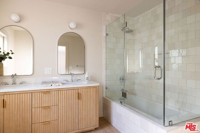 bathroom featuring bath / shower combo with glass door, tile patterned floors, and vanity