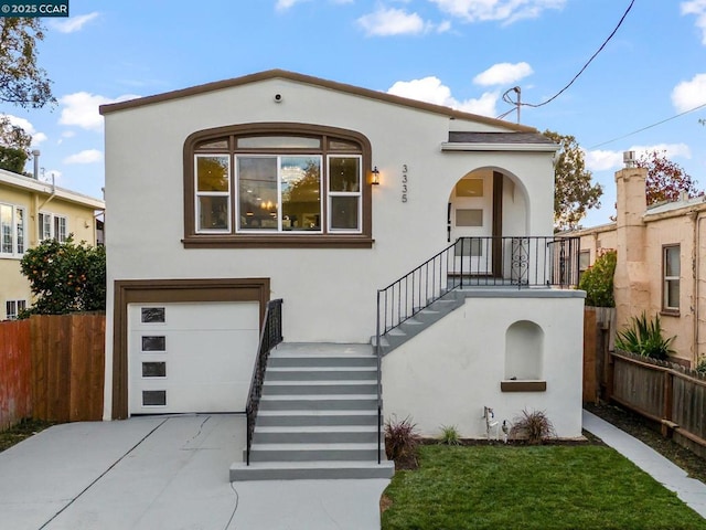 mediterranean / spanish-style house with a garage