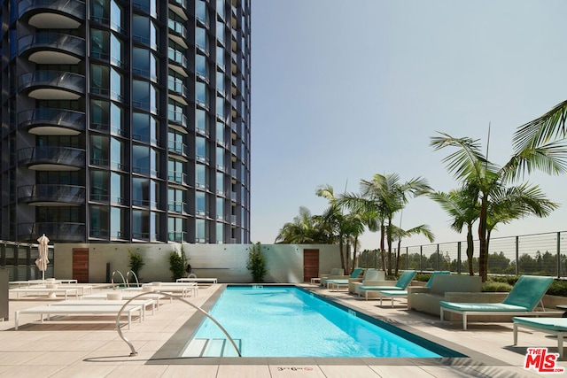 view of pool featuring a patio