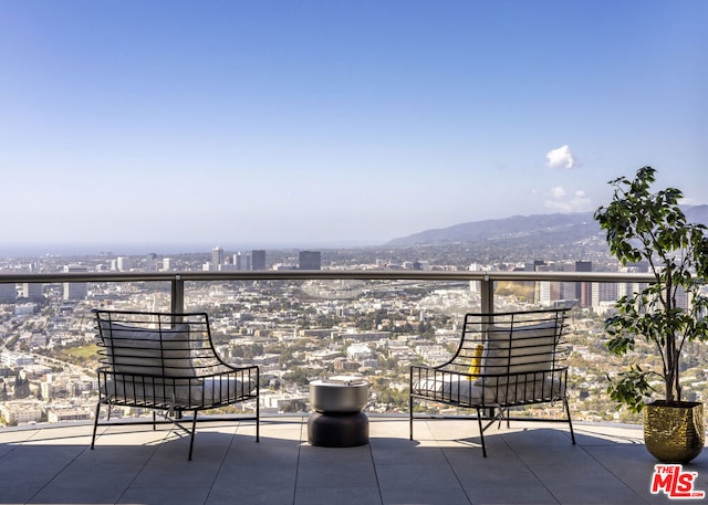 balcony featuring a mountain view