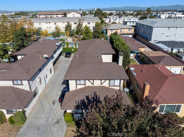 birds eye view of property with a mountain view