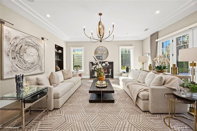 living room featuring a chandelier and a healthy amount of sunlight