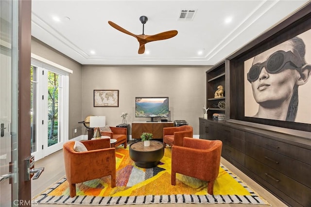 sitting room featuring ceiling fan