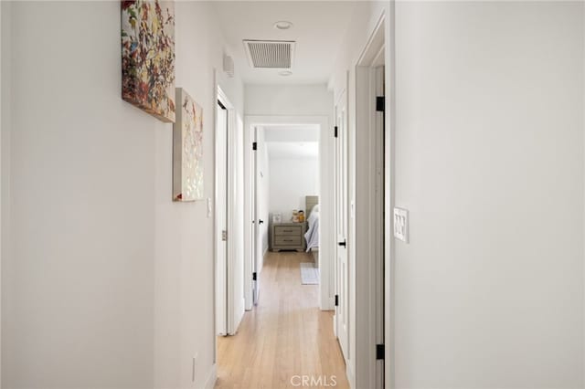 hallway featuring light hardwood / wood-style flooring