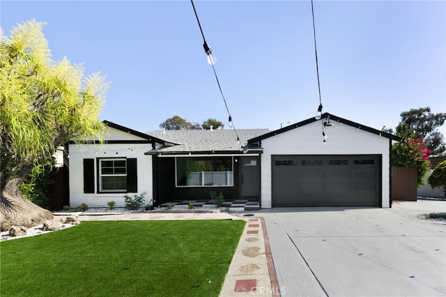 single story home with a garage and a front yard