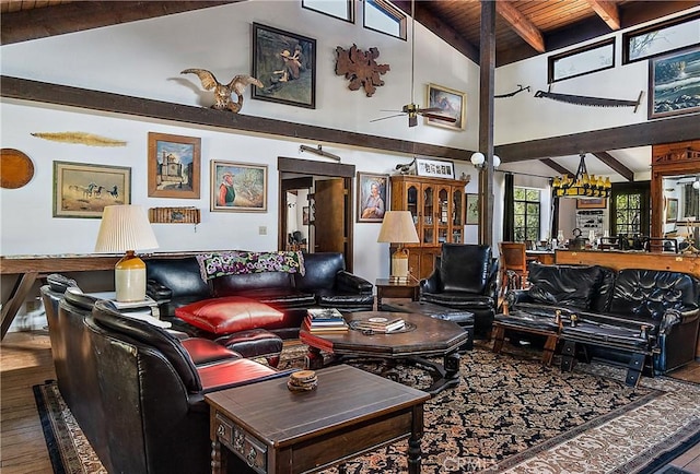 living room featuring ceiling fan with notable chandelier, wood ceiling, wood-type flooring, high vaulted ceiling, and beam ceiling