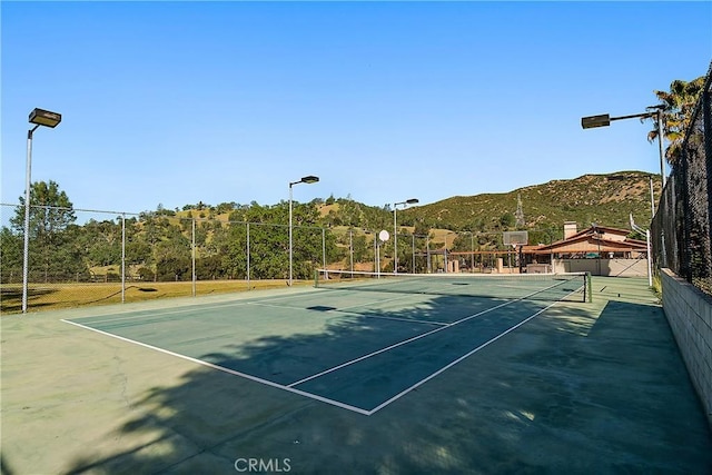 view of sport court featuring a mountain view