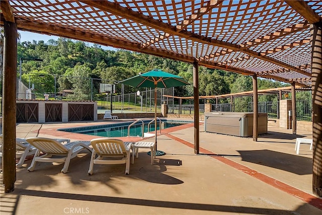 view of swimming pool with a pergola, a patio area, and a hot tub