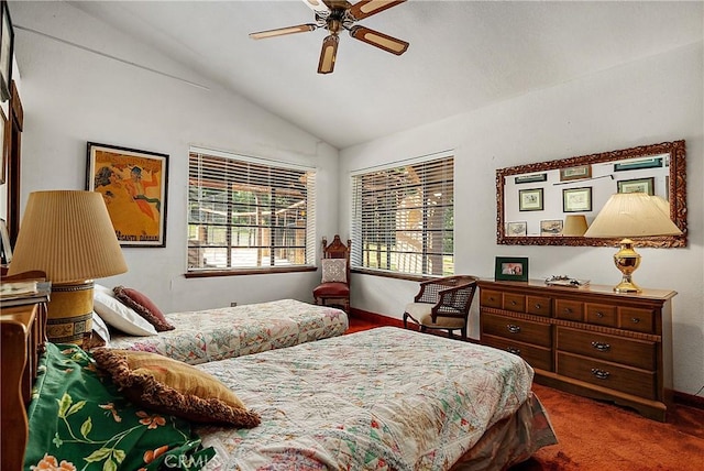 bedroom featuring ceiling fan, dark carpet, and lofted ceiling