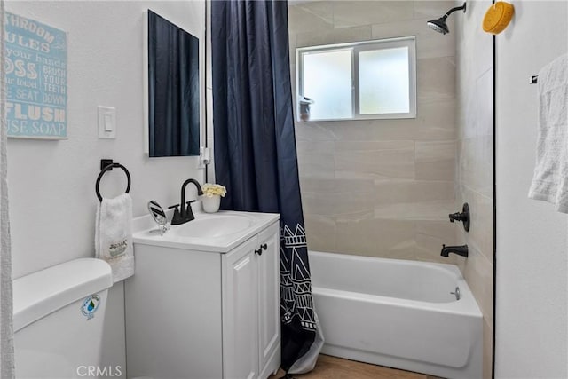 full bathroom with toilet, vanity, and shower / tub combo with curtain