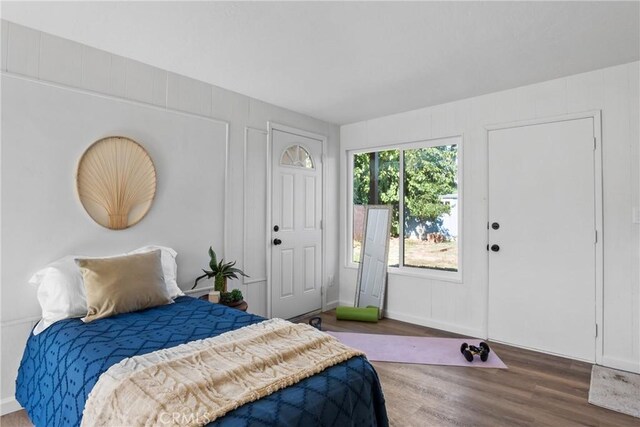 bedroom with hardwood / wood-style floors