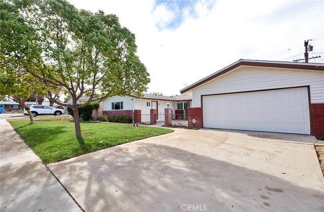 single story home featuring a front yard and a garage