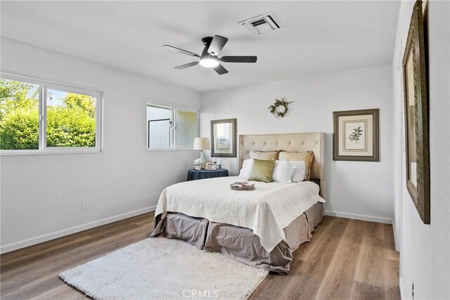 bedroom featuring ceiling fan and hardwood / wood-style floors