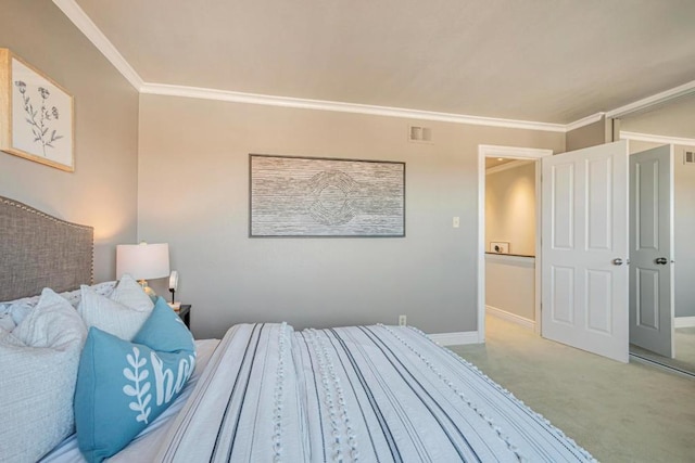 carpeted bedroom with ornamental molding