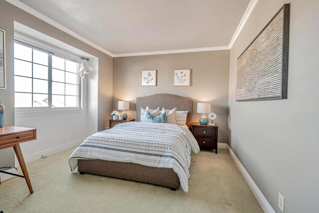 carpeted bedroom featuring crown molding