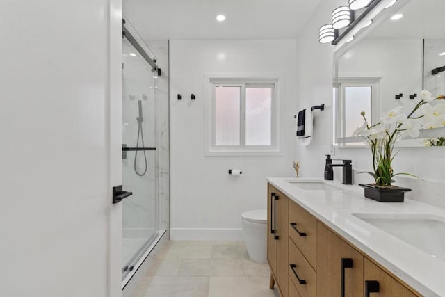 bathroom with toilet, vanity, tile patterned flooring, and a shower with shower door