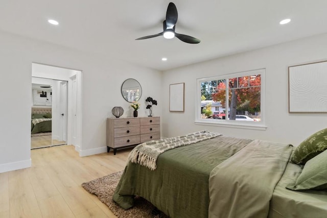 bedroom featuring ceiling fan and light hardwood / wood-style flooring