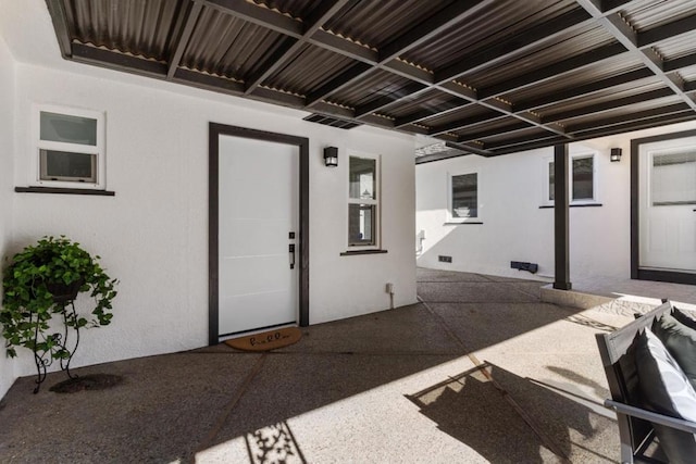 doorway to property with a patio