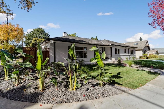 view of front of home with a front lawn