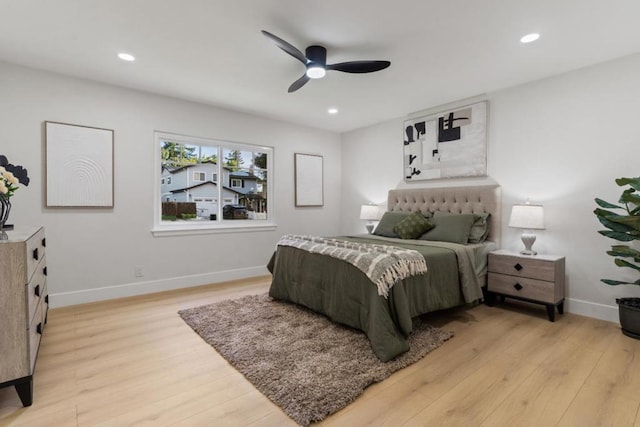 bedroom featuring ceiling fan and light hardwood / wood-style flooring