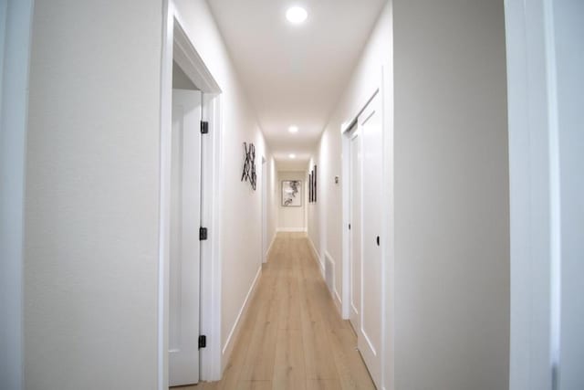 hallway with light wood-type flooring