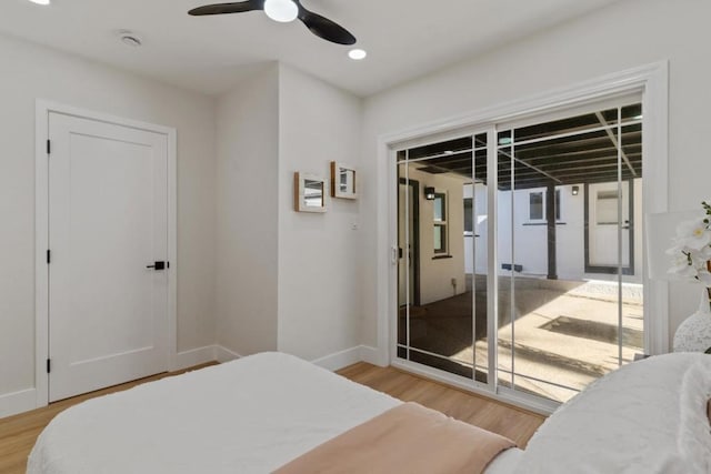 bedroom featuring ceiling fan, light hardwood / wood-style floors, and access to outside