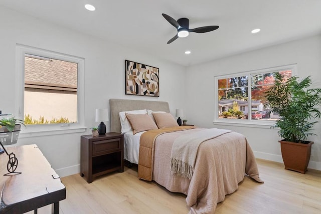 bedroom featuring ceiling fan and light hardwood / wood-style flooring