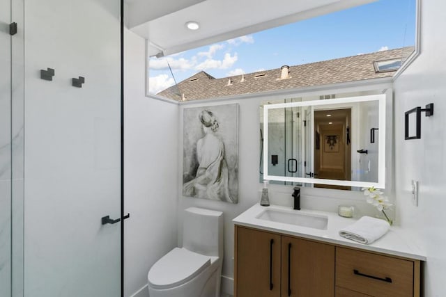 bathroom featuring toilet and vanity