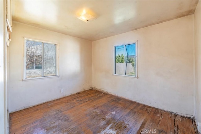 spare room with hardwood / wood-style flooring