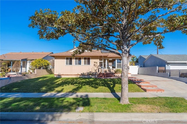 ranch-style home with a front lawn