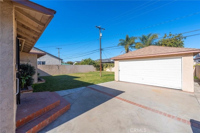 garage with a lawn