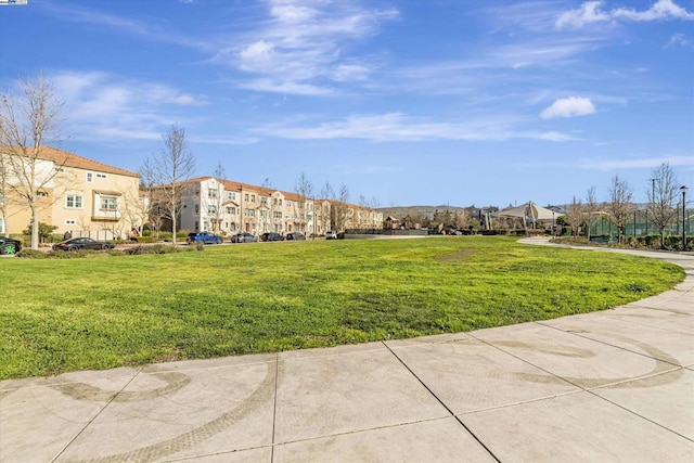 view of home's community with a lawn