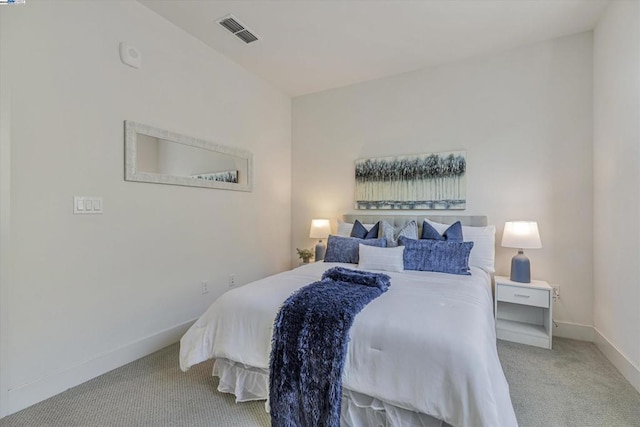 bedroom with light colored carpet