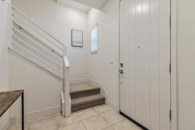 entryway featuring light tile patterned floors