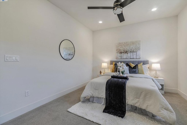 bedroom featuring ceiling fan and light carpet