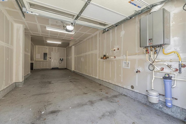 garage with electric panel, water heater, and a garage door opener