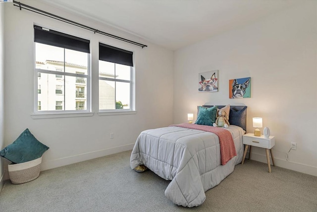 bedroom featuring light carpet